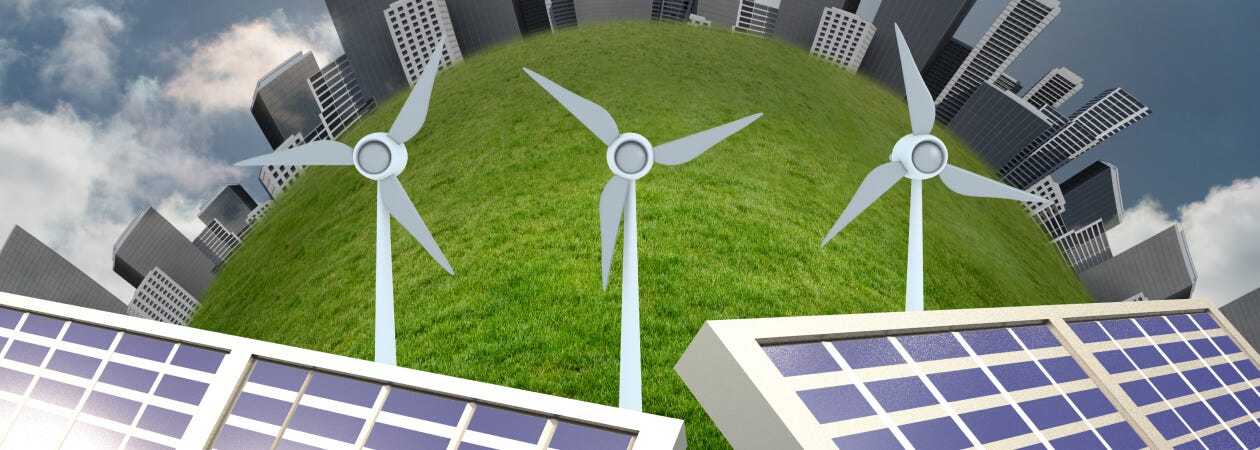 Solar panels and wind turbines on a green field, helping to reduce its carbon footprint.
