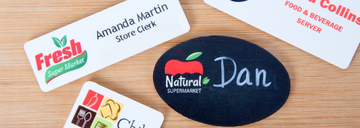Four eco-friendly custom plastic name taga
