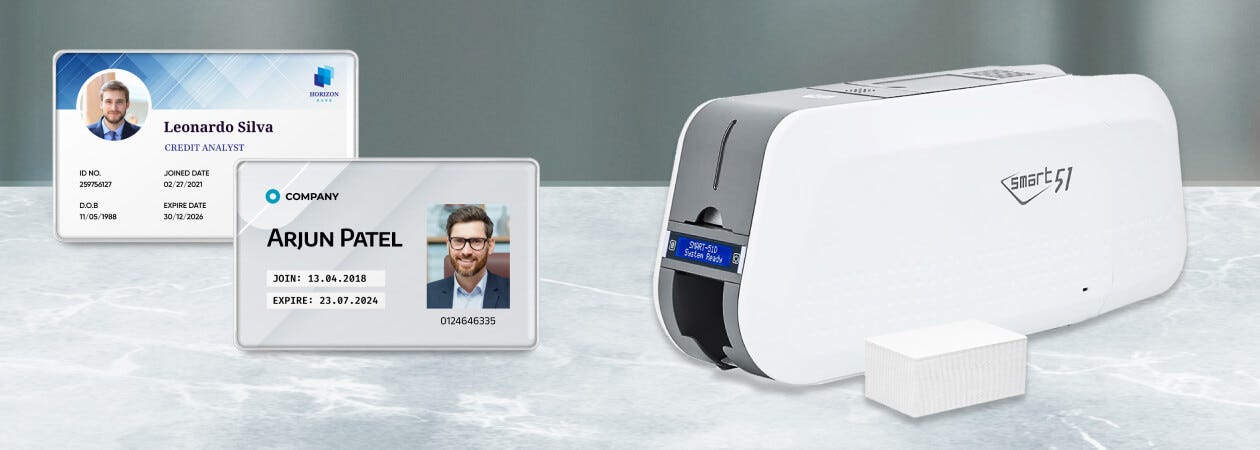 Image of an individual displaying a badge and a card produced by a Robust ID Card Printer.