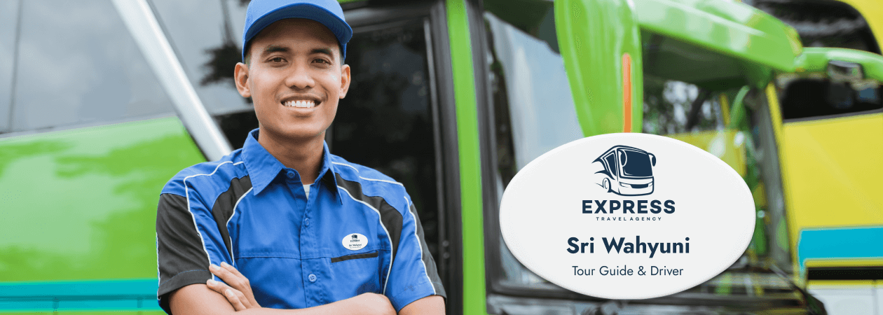 A man wearing a plastic name tag stands next to a bus