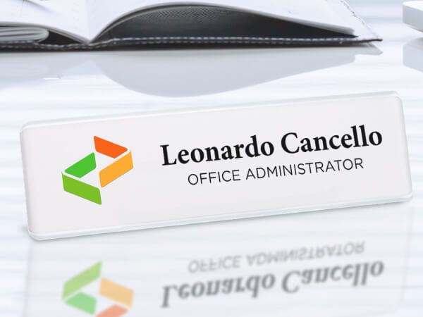 A reusable plastic name plate with a personalized design for identification purposes